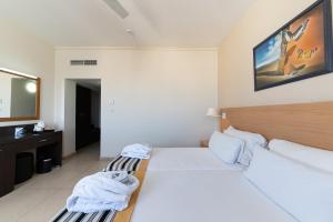 Кровать или кровати в номере The Preluna Hotel