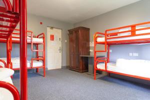 A bed or beds in a room at The Burren Hostel - Sleepzone