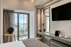 TV a/nebo společenská místnost v ubytování LAS HOTEL & SPA