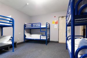 A bed or beds in a room at The Burren Hostel - Sleepzone