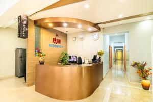 a lobby of a dental office with a reception desk at Octave Paris Residency in Bengaluru