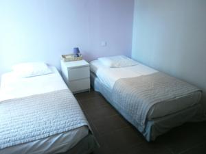 Postel nebo postele na pokoji v ubytování Hotel Restaurant La Frégate
