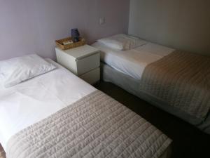Postel nebo postele na pokoji v ubytování Hotel Restaurant La Frégate