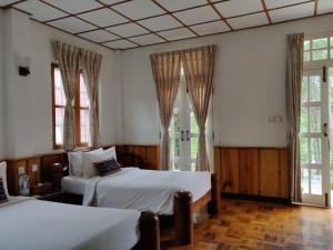 Postel nebo postele na pokoji v ubytování Hillock Villa