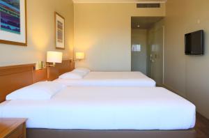 Cama ou camas em um quarto em Hotel Fundador
