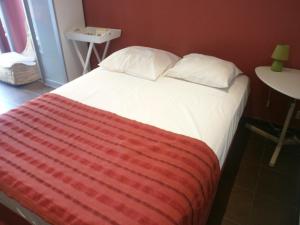 Postel nebo postele na pokoji v ubytování Hotel Restaurant La Frégate