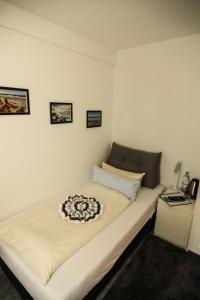 Ένα ή περισσότερα κρεβάτια σε δωμάτιο στο Kapitaenshaus-Lassen-Zimmer-Bounty