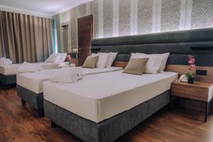 Postel nebo postele na pokoji v ubytování Inex Olgica Hotel & SPA
