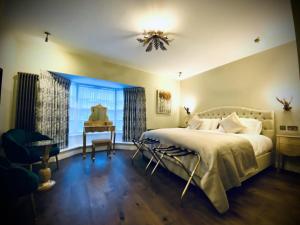 Katil atau katil-katil dalam bilik di The Cherry Tree Hotel