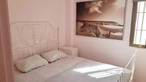 Łóżko lub łóżka w pokoju w obiekcie Apartment Avenida Puig