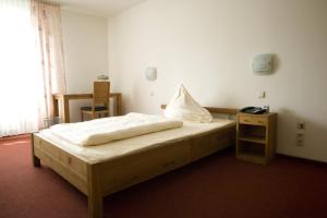 Postel nebo postele na pokoji v ubytování Hotel Flora