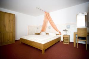 Postel nebo postele na pokoji v ubytování Hotel Flora
