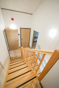 a staircase in a room with two lockers at LVM tūrisma un atpūtas centrs "Spāre" in Spāre