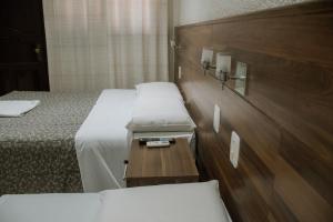 Postel nebo postele na pokoji v ubytování Hotel Masseilot