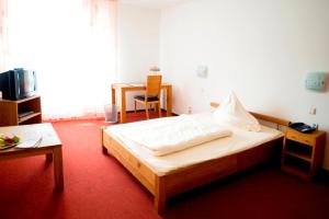 Postel nebo postele na pokoji v ubytování Hotel Flora