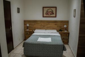 Postel nebo postele na pokoji v ubytování Hotel Masseilot