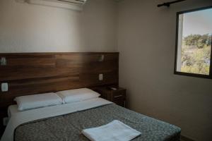 Postel nebo postele na pokoji v ubytování Hotel Masseilot