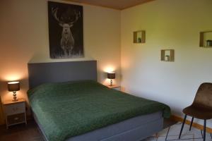 Voodi või voodid majutusasutuse Gîte du cheval blanc d'Houmont toas