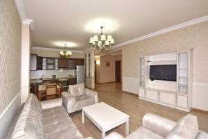 a living room with a couch and a table at Northern Avenue, 2 bedrooms Unique, Luxury apartment with Special Open balcony HH567 in Yerevan