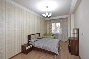 a bedroom with a bed and a dresser in it at Northern Avenue, 2 bedrooms Unique, Luxury apartment with Special Open balcony HH567 in Yerevan