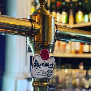 a close up of a bottle of beer on a bar at Två Små Svin BnB in Trosa