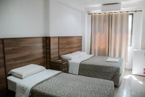 Postel nebo postele na pokoji v ubytování Hotel Masseilot
