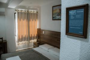 Postel nebo postele na pokoji v ubytování Hotel Masseilot