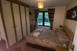 מיטה או מיטות בחדר ב-Glenfiddich