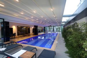 a large swimming pool in a building with a building at Апартаменты Best Home 26 Cleopatra Legacy in Alanya