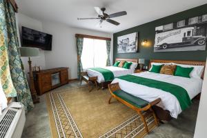 Postel nebo postele na pokoji v ubytování Pivovar Hotel