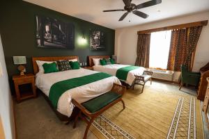 En eller flere senge i et værelse på Pivovar Hotel