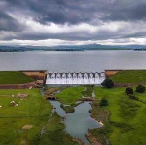 an aerial view of a dam on a body of water at Yellowwoods Farm - THE GOAT HOUSE in Curryʼs Post