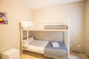a bedroom with two bunk beds in a room at Recogidas Apartment 23 in Granada