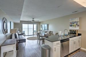 a kitchen and living room with a view of the ocean at Middle Bass Condo with Balcony, Lake Erie Views in Put-in-Bay
