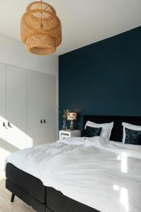 Een bed of bedden in een kamer bij Huize Copes apartment Den Haag, 2 bed, 2 bath