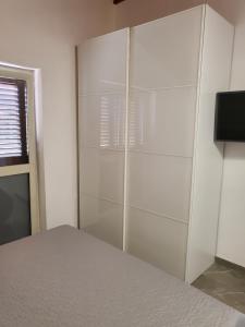 TV a/nebo společenská místnost v ubytování Residenza Carlucci