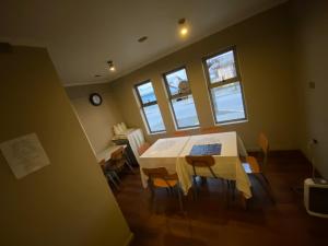 a dining room with a white table and chairs at Hotel San Martin in Cabrero +12 photos