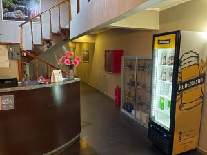 a museum with a vending machine in a hallway at Hotel San Martin in Cabrero
