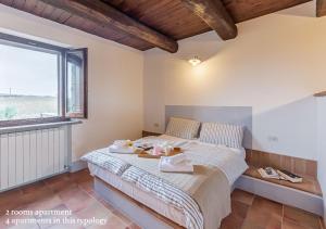 A bed or beds in a room at Borgo Solario