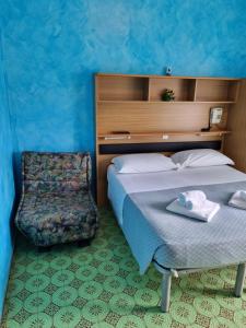 Voodi või voodid majutusasutuse Albergo Stella Di Mare toas