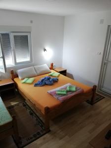a bedroom with a large bed in a room at Sobe i apartmani Simic in Ribarska Banja