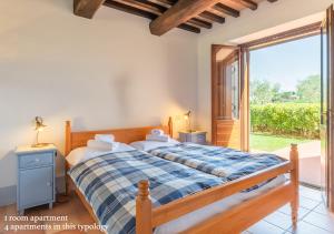 A bed or beds in a room at Borgo Solario