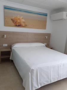 Postel nebo postele na pokoji v ubytování Hotel Iberflat Marynton