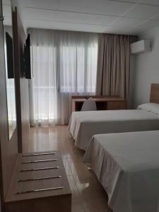 Postel nebo postele na pokoji v ubytování Hotel Iberflat Marynton