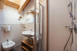a bathroom with a shower and a sink and a toilet at Apartment Sotmarin in La Villa