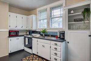 a kitchen with white cabinets and a sink at 16 Saragossa Street B in St. Augustine