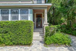 a house with a door and some bushes at 16 Saragossa Street B in St. Augustine