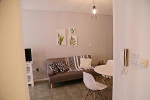 a living room with a couch and a table at CHIVILCOY APART in Chivilcoy