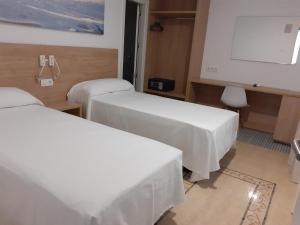 Postel nebo postele na pokoji v ubytování Hotel Iberflat Marynton