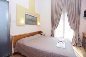 Voodi või voodid majutusasutuse Aegeon Hotel toas